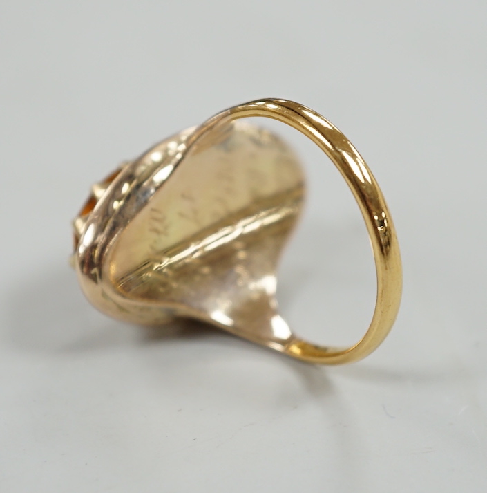 A 22ct gold and citrine set ring, composed from a 22ct gold shank and a George III mourning ring.